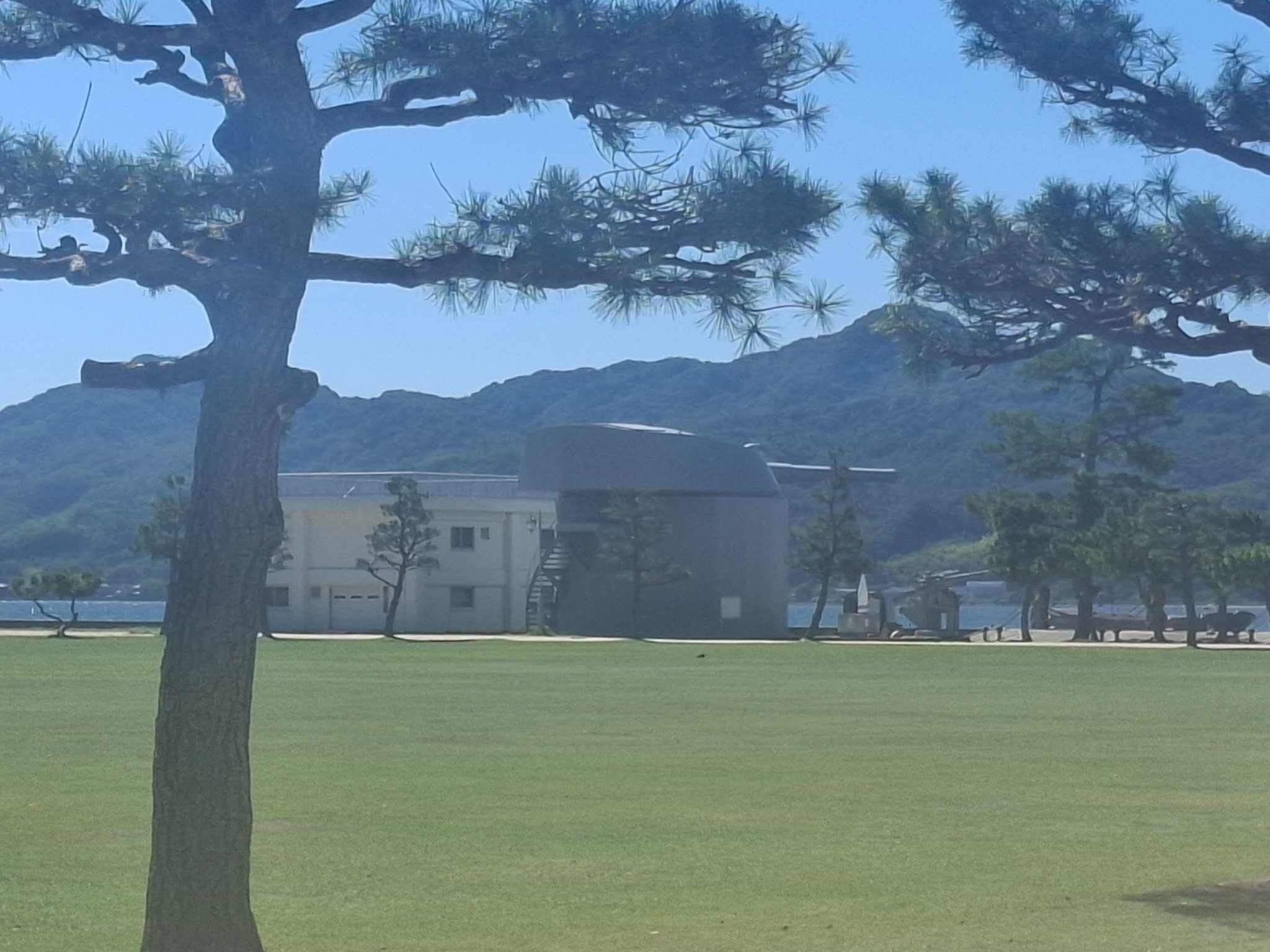Mutsu No. 4 16-inch gun turret viewed from across the grounds at Etajima